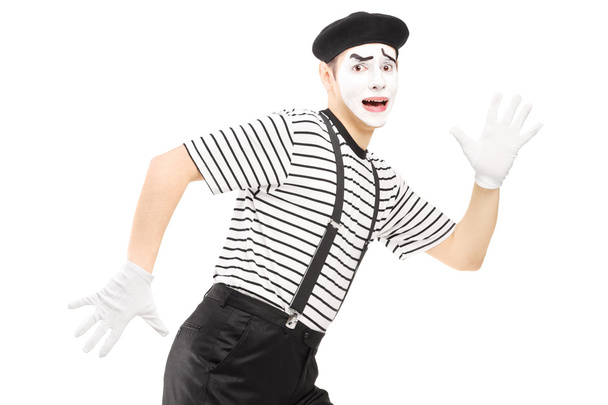 Scared mime artist running away - Photo, image