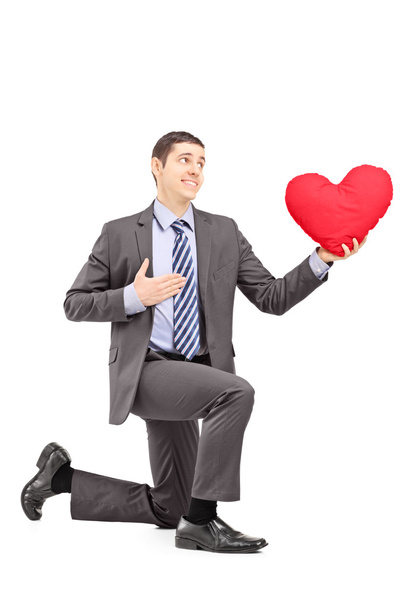 Male kneeling with red heart - Photo, image