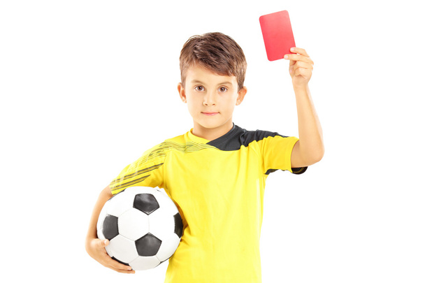 Kid holding soccer ball and red card - Zdjęcie, obraz