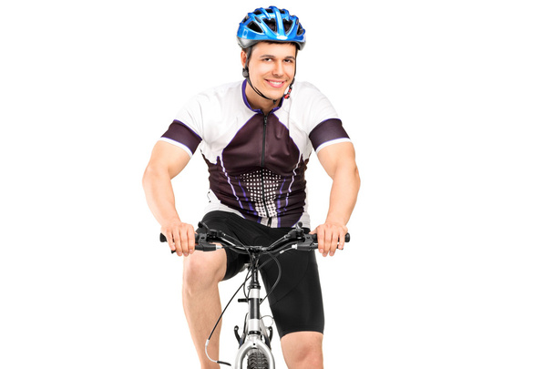 Male bicyclist posing on bicycle - Фото, зображення