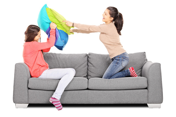 Girls having a pillow fight - Zdjęcie, obraz