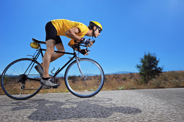 Cyclist riding bike - Foto, Bild