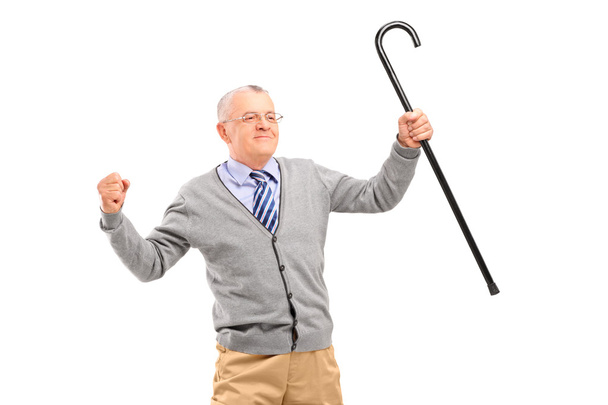 Senior man holding cane - Foto, immagini
