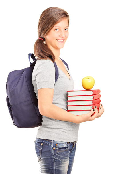 Schoolgirl holding books - Фото, зображення