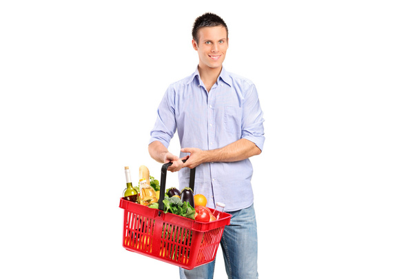 Man holding shopping basket - Photo, image