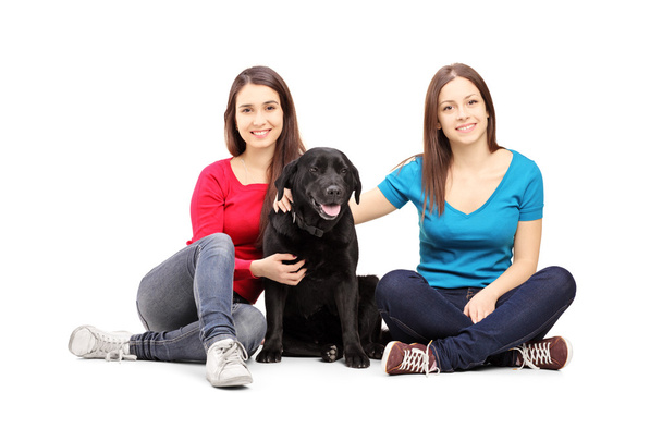 Two female with black dog - Foto, Imagen