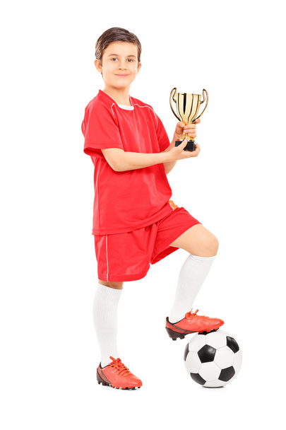 Junior football player holding trophy - Zdjęcie, obraz