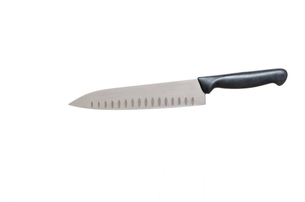 Grand couteau de cuisine sur fond blanc. Couteau de chef. Lame de couteau entaillée.. - Photo, image