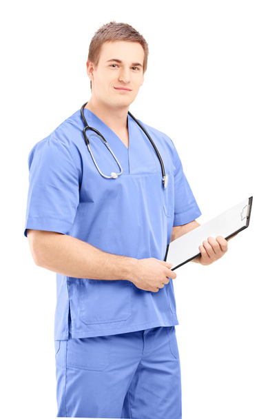 Male medical doctor holding clipboard - Photo, image