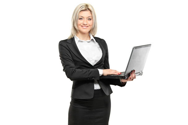Businesswoman working on laptop - Foto, afbeelding