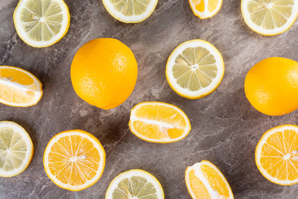 fresh yellow lemons on a grey background   - Foto, immagini