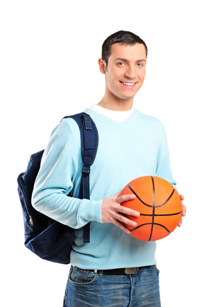Young man holding basketball - Фото, зображення