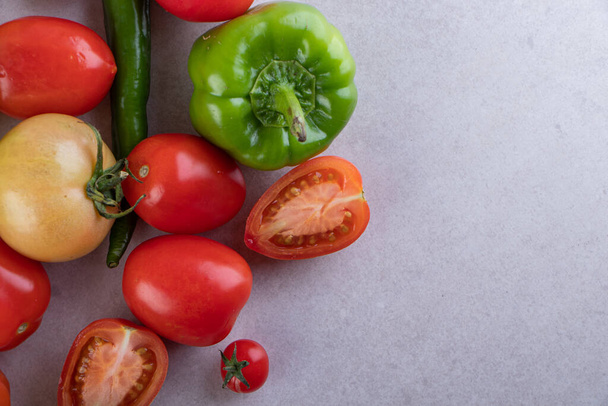 fresh organic vegetables on grey background - Foto, imagen