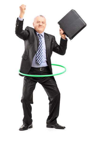 Businessman dancing with hula hoop - Foto, immagini