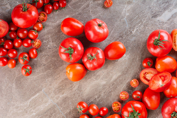 fresh tomatoes on kiktchen table background  - Photo, Image