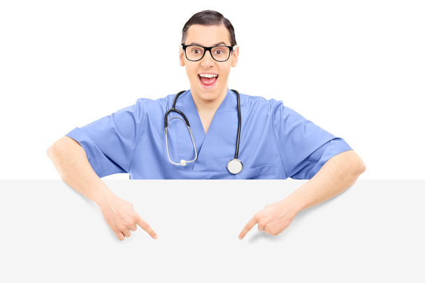 Doctor pointing on blank panel - Фото, зображення