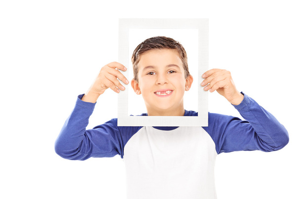 Young boy holding a picture frame  - Zdjęcie, obraz