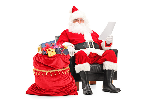 Santa Claus reading letter - Foto, afbeelding