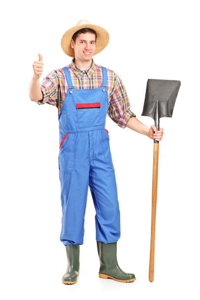 Agricultural worker holding shovel - Photo, image