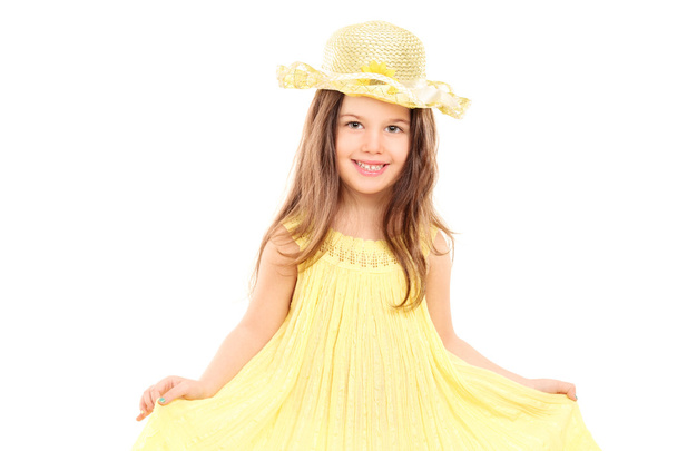 Girl holding her yellow dress - Zdjęcie, obraz