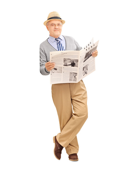 Gentleman holding newspaper - Zdjęcie, obraz