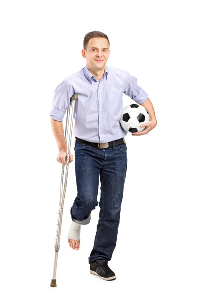 Injured young man on crutches - Photo, Image