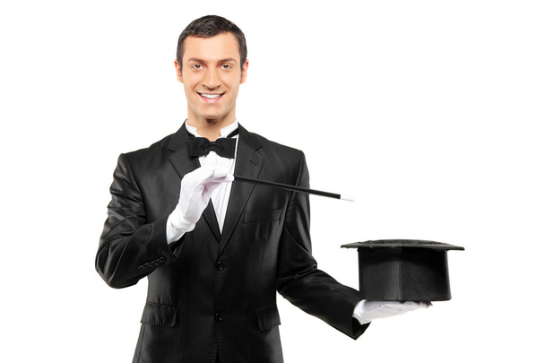 Magician holding empty top hat - Фото, изображение