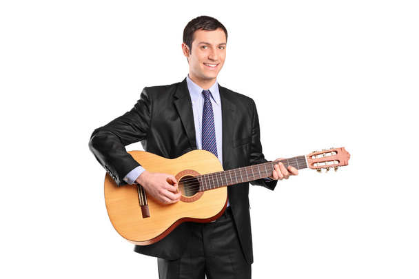 Man playing acoustic guitar - Фото, зображення