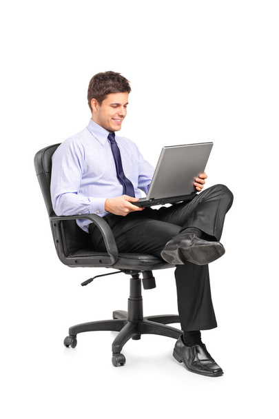 Businessman sitting in office chair - 写真・画像