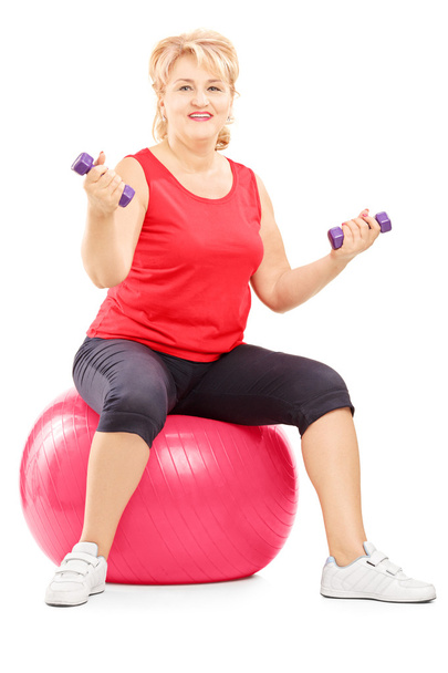 Female sitting on fitness ball - Photo, Image