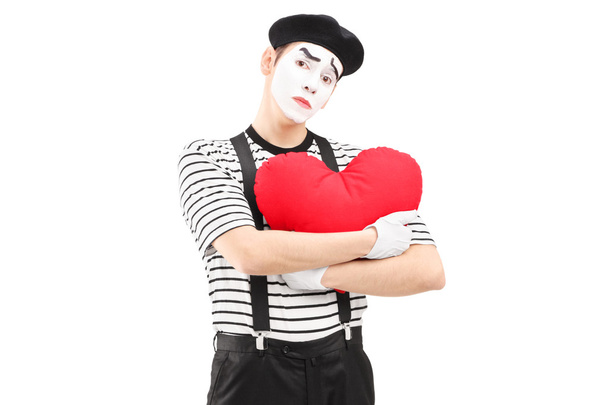 Sad mime artist holding red heart - Fotoğraf, Görsel