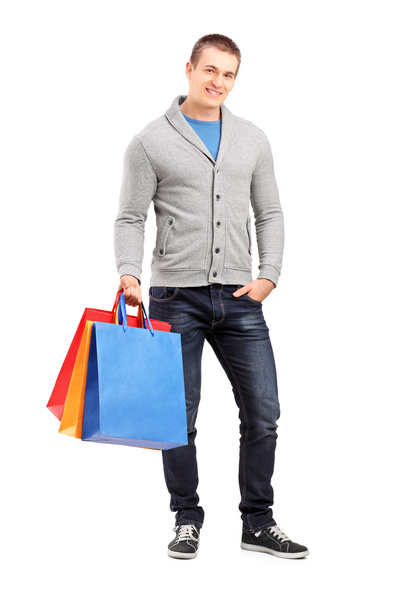 Casual man holding shopping bags - 写真・画像