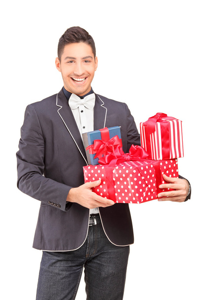 Guy holding presents - Foto, afbeelding