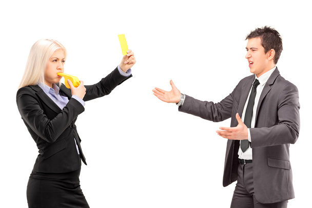Woman showing yellow card to man - 写真・画像
