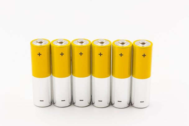 Composition with alkaline batteries on white background. Chemical waste - Photo, Image