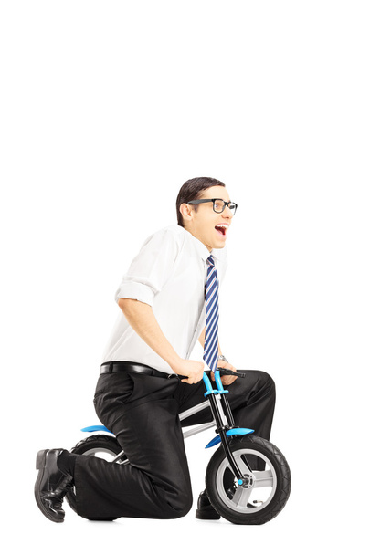 Businessperson riding small bicycle - Foto, Imagem