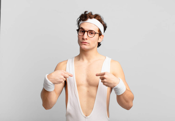 humorous sport man looking proud, positive and casual pointing to chest with both hands - Фото, зображення