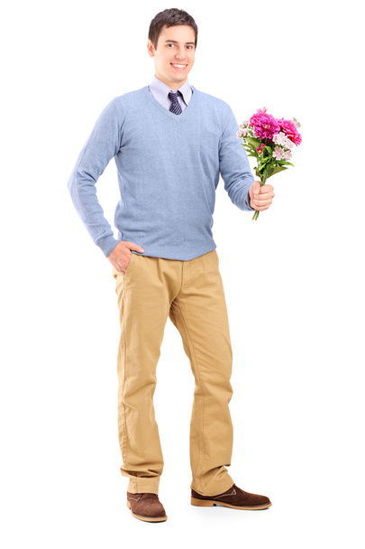 Romantic man holding flowers - Zdjęcie, obraz