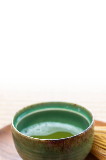 green matcha tea  cup on a wooden table - Фото, зображення