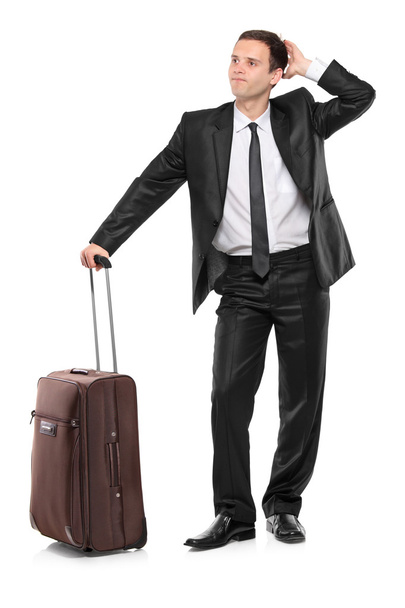 Worried businessman with suitcase - Fotó, kép
