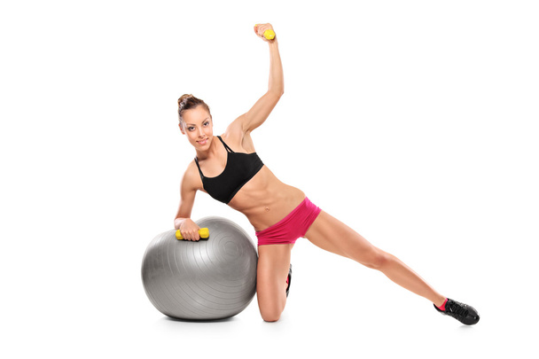 Female working out with dumbbells - Photo, Image