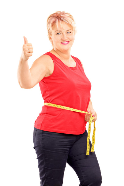 Woman measuring waist after diet - Zdjęcie, obraz