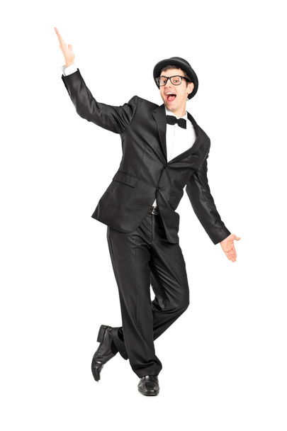 Man in bow tie suit dancing - 写真・画像