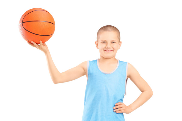 Smiling child holding basketball - Photo, Image
