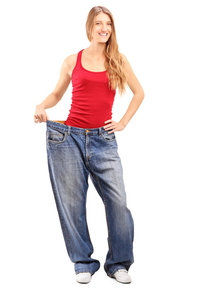 Weigh loss female with old jeans - Zdjęcie, obraz