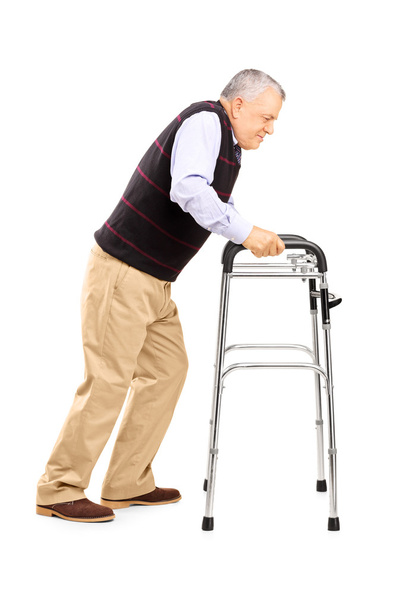 Old man struggling to move with walker - 写真・画像