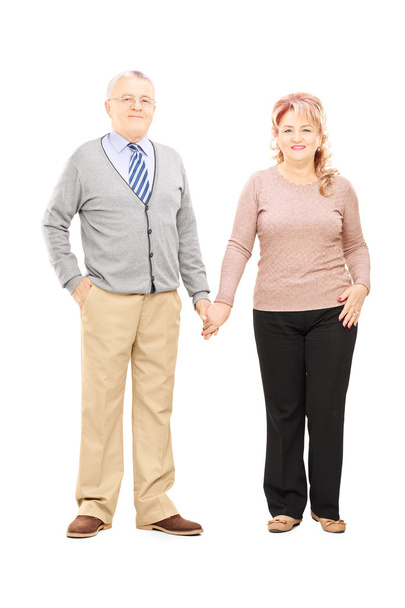 Middle aged couple holding hands - Photo, image