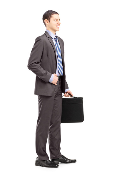 Businessman holding briefcase - Фото, зображення