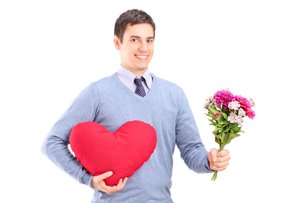 Man holding flowers and red heart - Valokuva, kuva