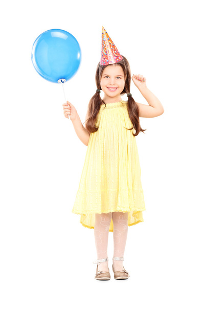 Girl with party hat holding balloon - Φωτογραφία, εικόνα